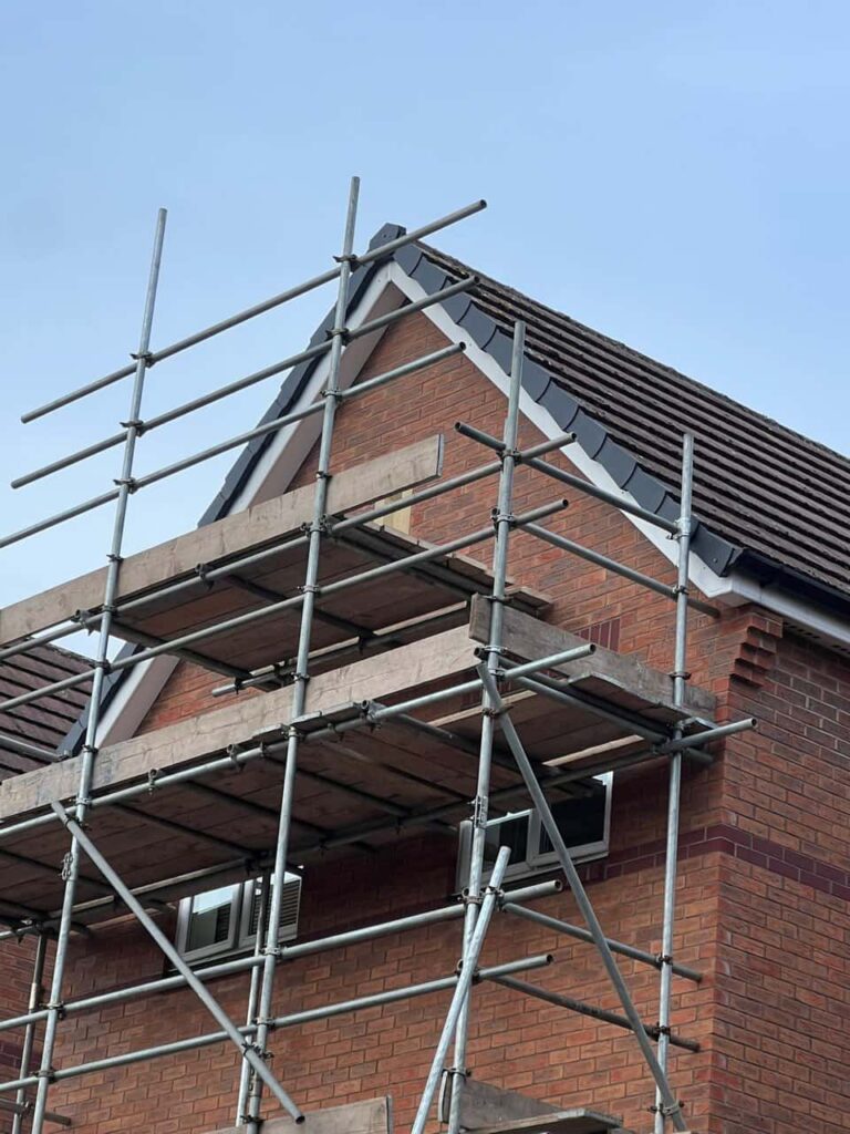 This is a photo of a roof which has just been repaired. There is a scaffold located at the gable end for access onto the roof. Works carried out by MCM Roofing Repairs Devizes