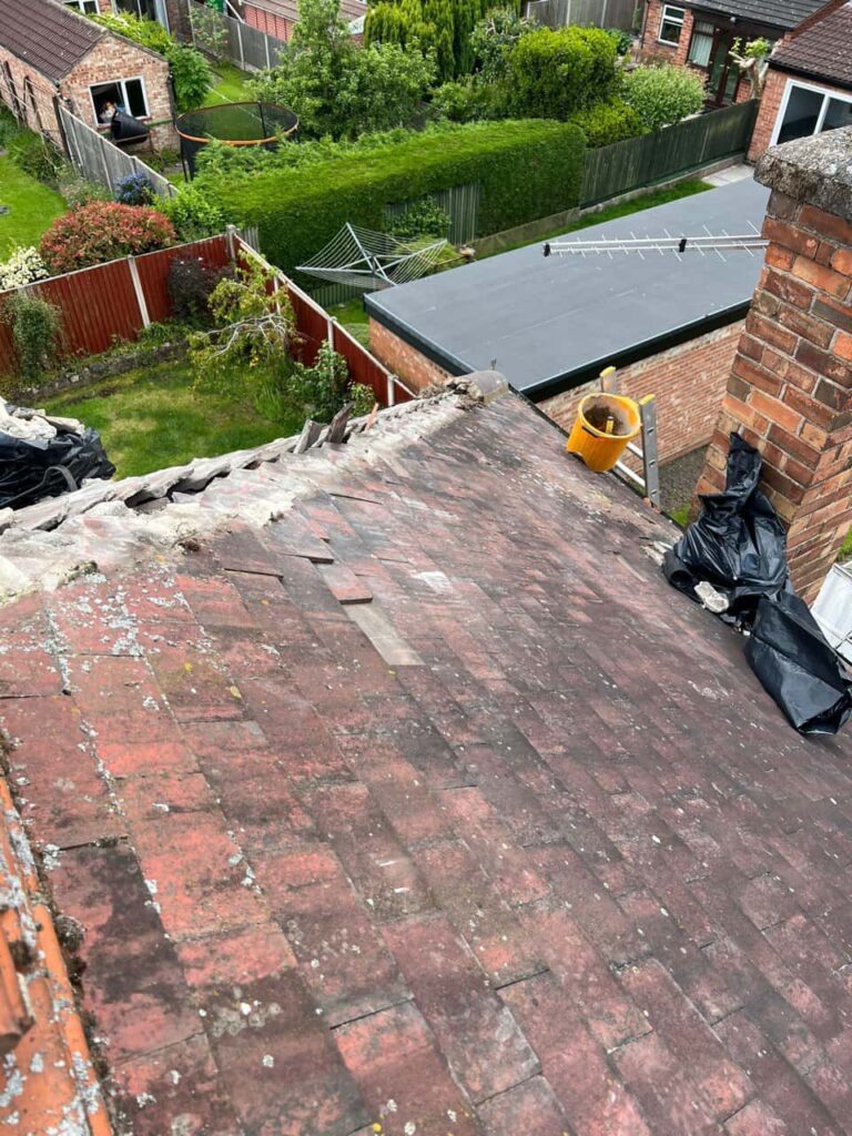 This is a photo of a roof where the hip tiles have been removed, and are just about to be replaced. Works carried out by MCM Roofing Repairs Devizes