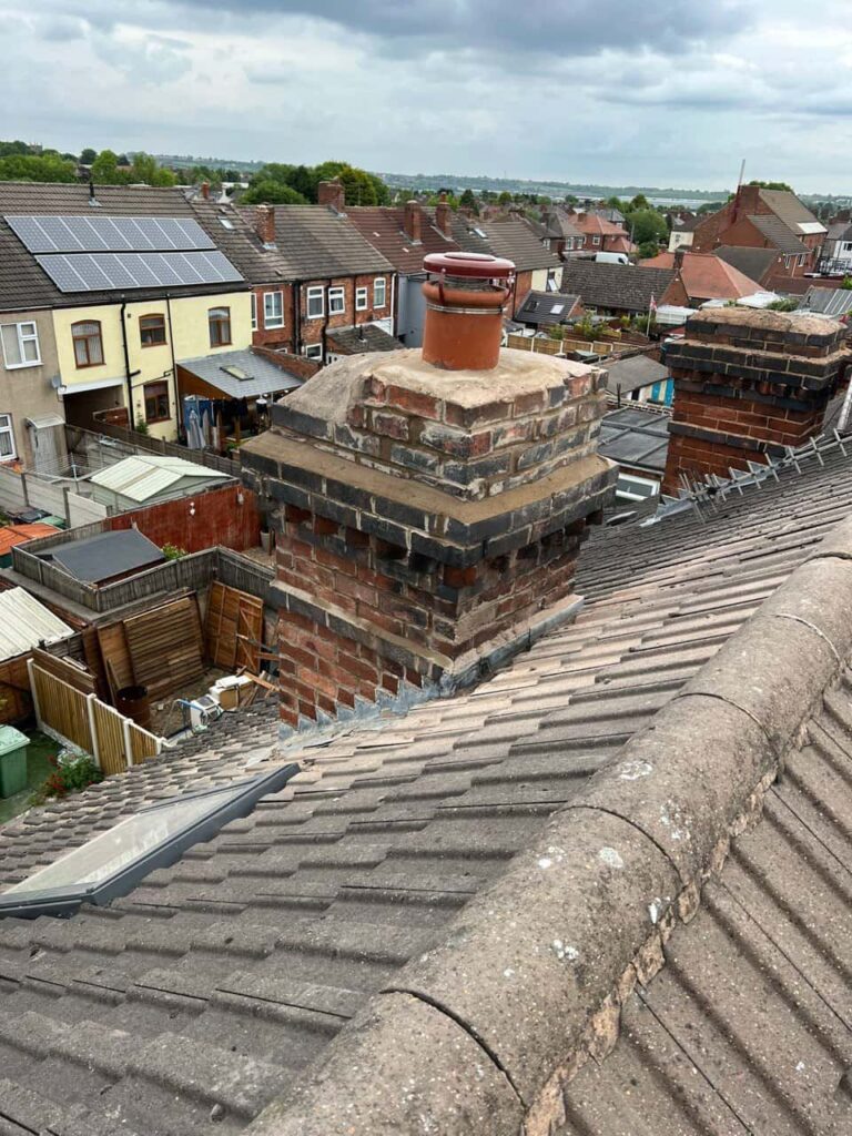 This is a photo taken from a roof which is being repaired by MCM Roofing Repairs Devizes, it shows a street of houses, and their roofs